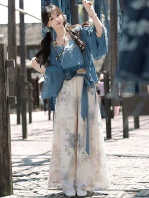 Side view of dusty blue New Chinese Style modern Hanfu outfit with flowing batwing sleeve cardigan and wide-leg pants