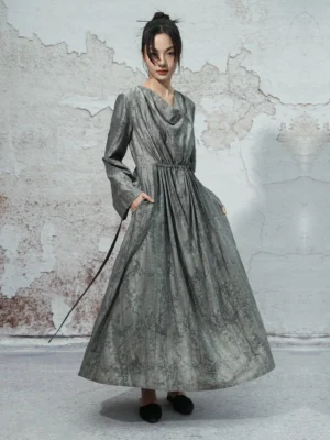 Dusty grey cowl neck modern Hanfu maxi dress shown in left three-quarter front view with long sleeves, gathered waist sash and flowing A-line skirt