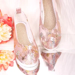 Pair of dusty pink embroidered Hanfu shoes showing the pearl toe ornament, breathable woven insole, layered white sole, and floral Chinese shoe design