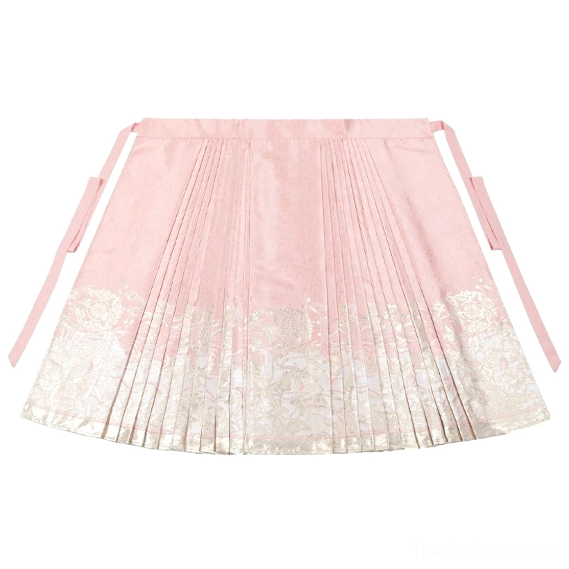 Flat lay of dusty pink Mamianqun horse face skirt with pleats side fastening straps and gold floral bamboo jacquard hem