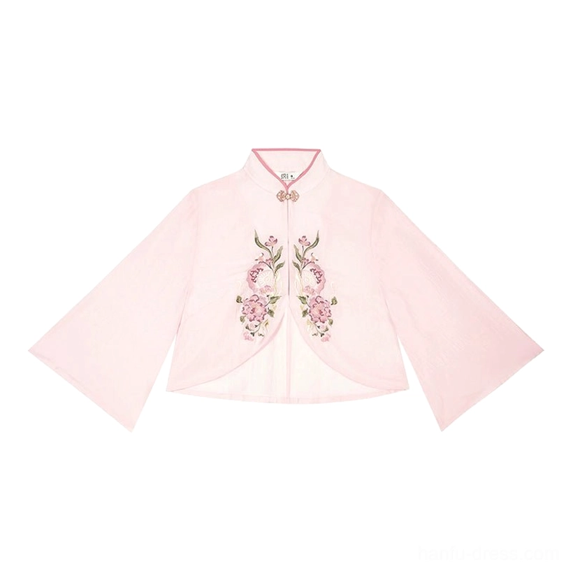 Flat lay of a dusty pink Ming Dynasty inspired hanfu blouse with stand collar, frog buttons, floral embroidery, and wide flared sleeves
