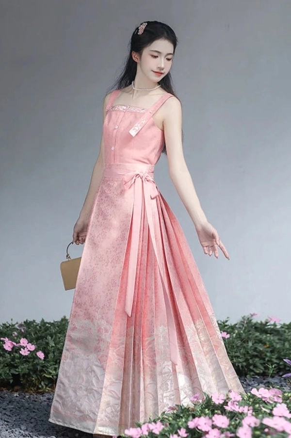 Side view of dusty pink Ming Dynasty Hanfu camisole and high waisted Mamianqun horse face skirt among flowers
