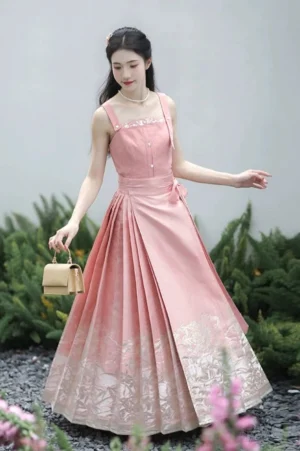 Dusty pink Ming Dynasty inspired Hanfu bustier and Mamianqun horse face skirt worn in a garden front view