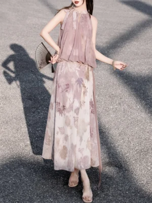 Three-quarter side view of a dusty pink Chinese-style Hanfu two-piece outfit with halter neck tie, printed maxi skirt, and decorative side sash