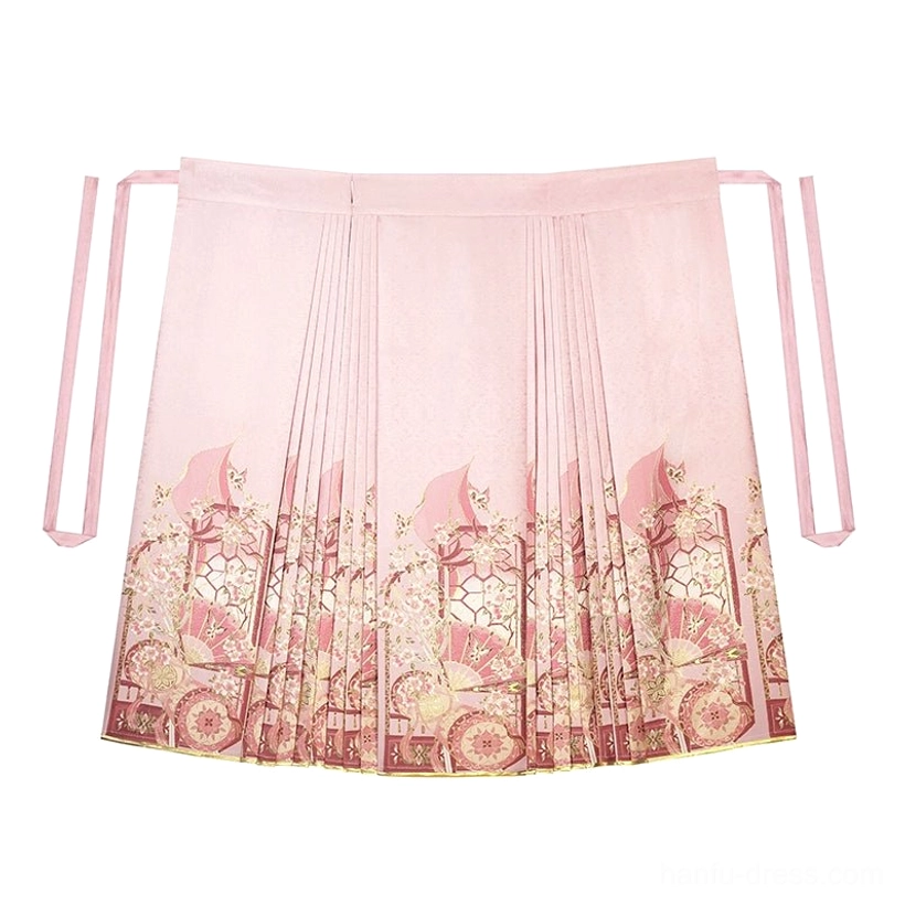 Flat lay of a dusty pink traditional mamian hanfu skirt with side tying straps, pleats, and vintage garden print hem