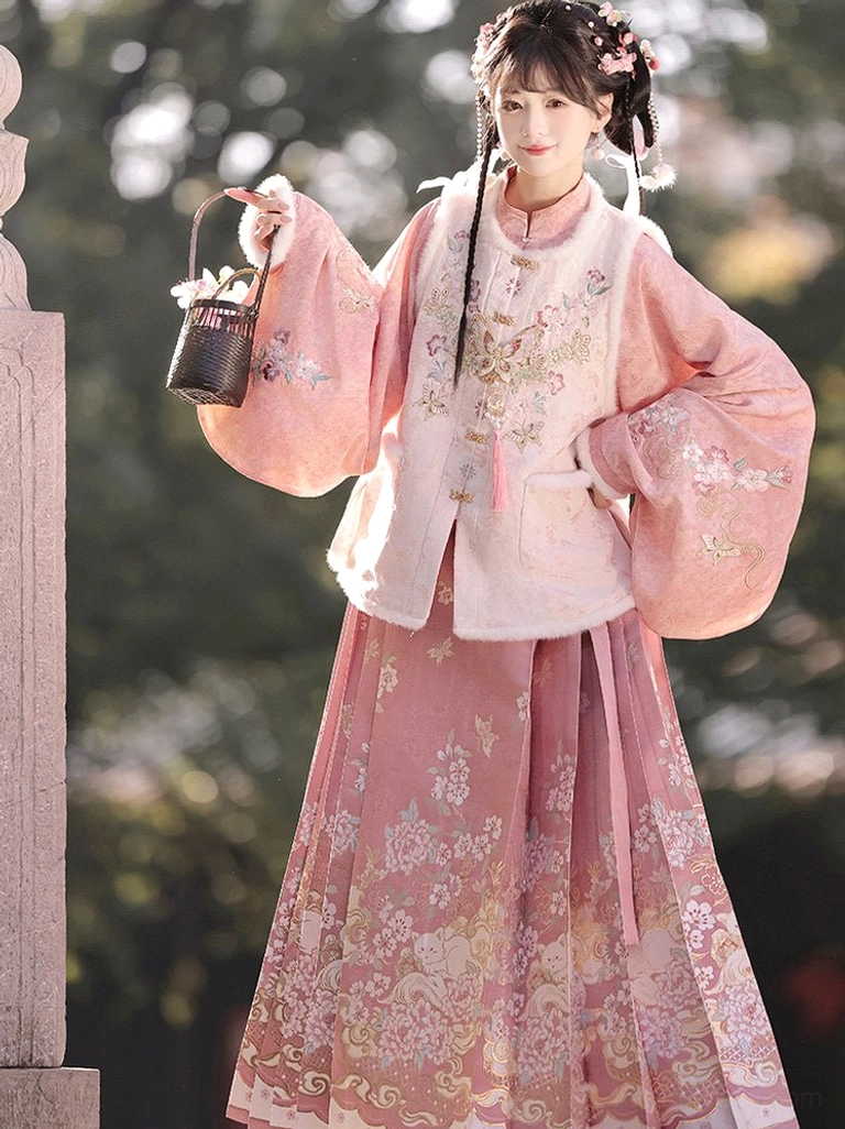 Dusty rose Ming Dynasty Hanfu set with floral mamian skirt embroidered bijia vest and tassel pendant styled in a traditional garden