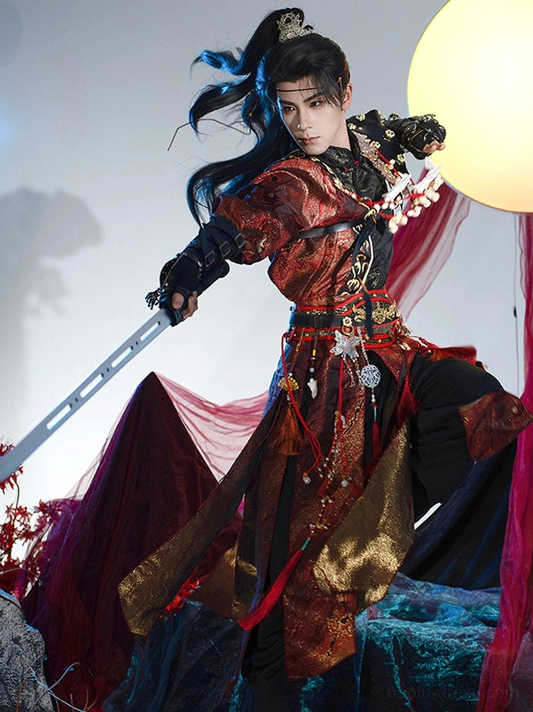 Dynamic male model in flowing crimson red and gold layered wuxia hanfu robes with a wind-swept hairstyle and decorated sword in a fantasy action pose