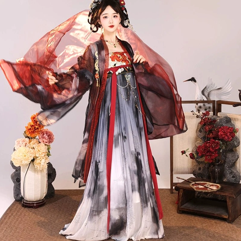 Dynamic front view of Tang Dynasty Hanfu Qixiong Ruqun with wine-red wide-sleeved outer coat, gradient ink-wash skirt, red trims, and hanging chest pendants