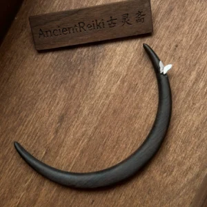 Ebony crescent Chinese hair stick with delicate white butterfly ornament displayed on a wooden surface, elegant Hanfu hair accessory for traditional Chinese hairstyles, cheongsam, qipao, and modern updos