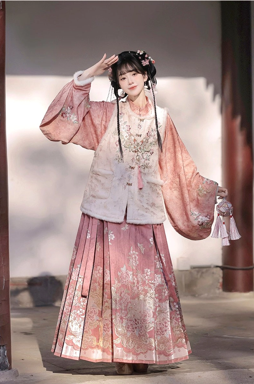 Elegant dusty rose Ming Dynasty Hanfu full set with embroidered vest lantern sleeves and floral mamian skirt near red pillars