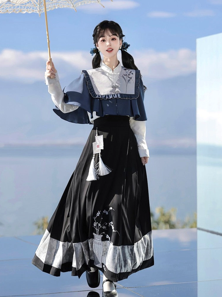 Close three-quarter view of embroidered vase and plum blossom mamianqun horse face skirt with ruffled Hanfu shawl
