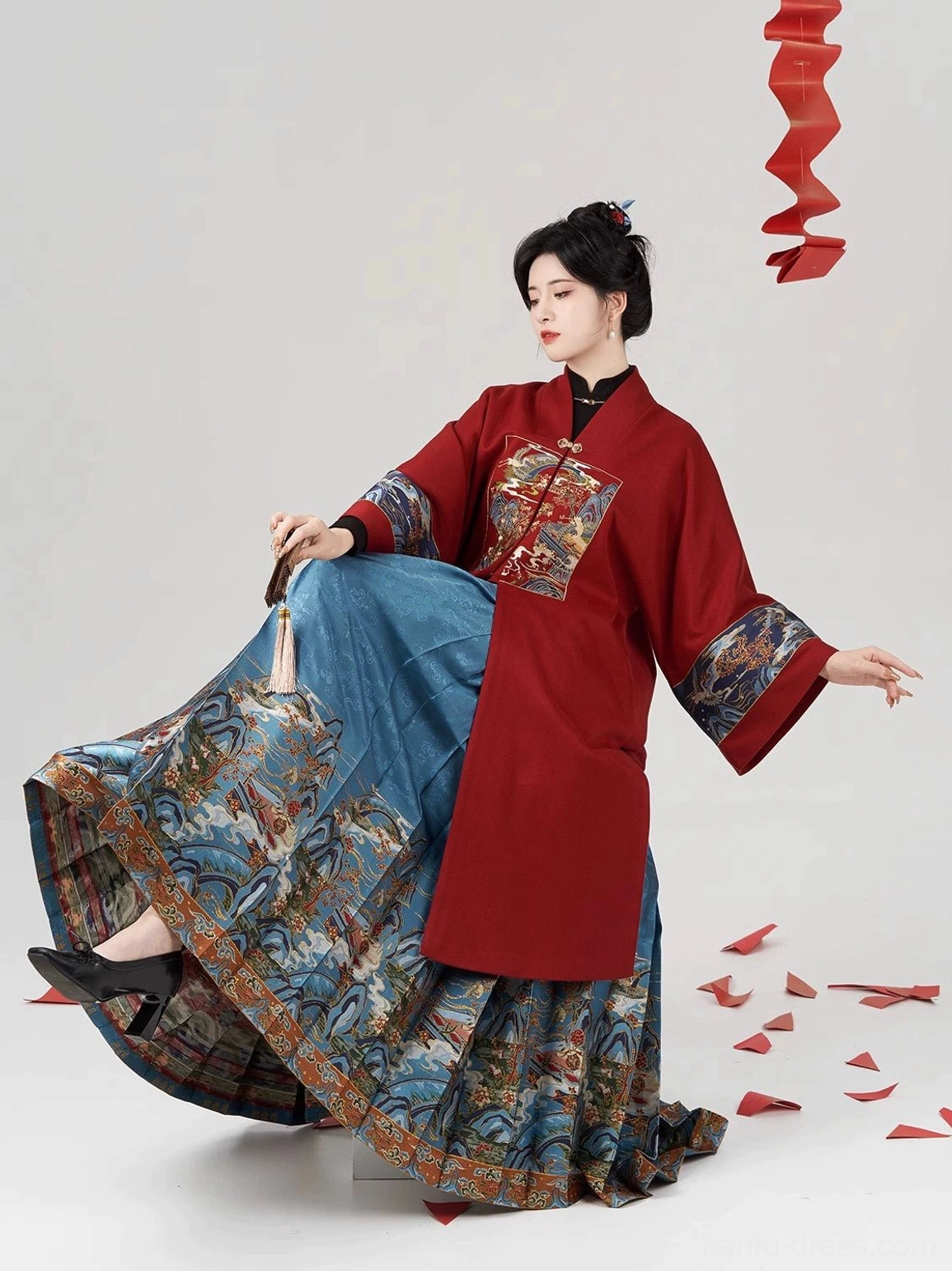 Fairy Feathers Ming Dynasty Hanfu outfit with wine red cross-collar coat and blue pleated mamianqun horse-face skirt, three-quarter seated view