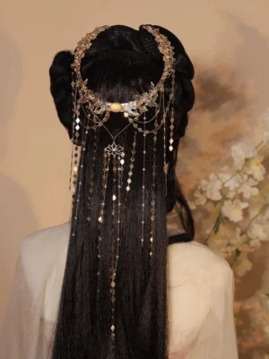 Fairy Queen antique gold Chinese back hair crown pin worn with Hanfu, featuring floral metal ornaments, a yellow central bead, and long flowing tassel chains