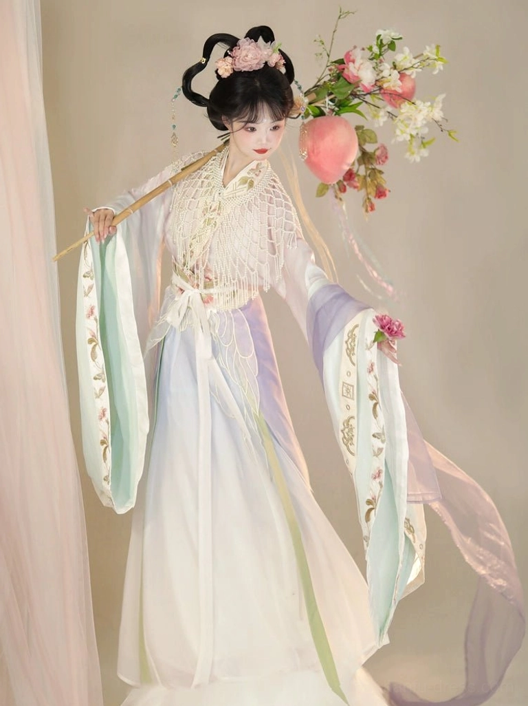 Fairy-style Wei Jin Dynasty Hanfu set with pastel gradient colors, delicate embroidery, flowing sleeves, and white tassel shoulder shawl styling