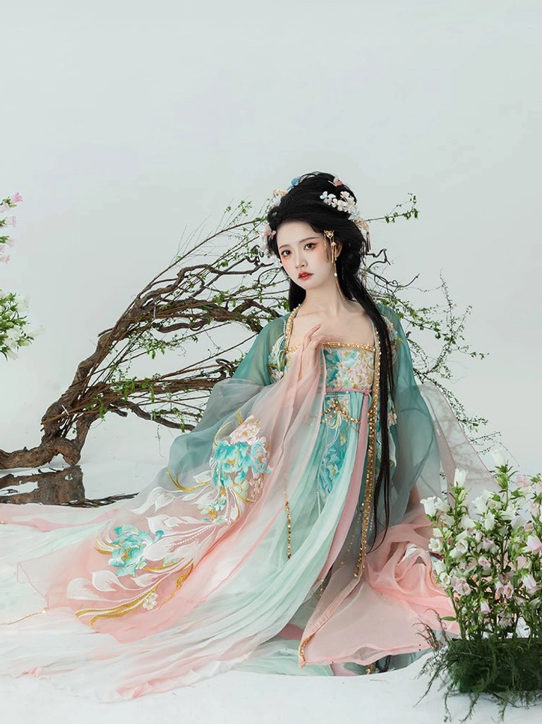 Fairy style Tang Dynasty Hanfu Qixiong Ruqun viewed from the side with flowing pleated skirt train and delicate floral embroidery