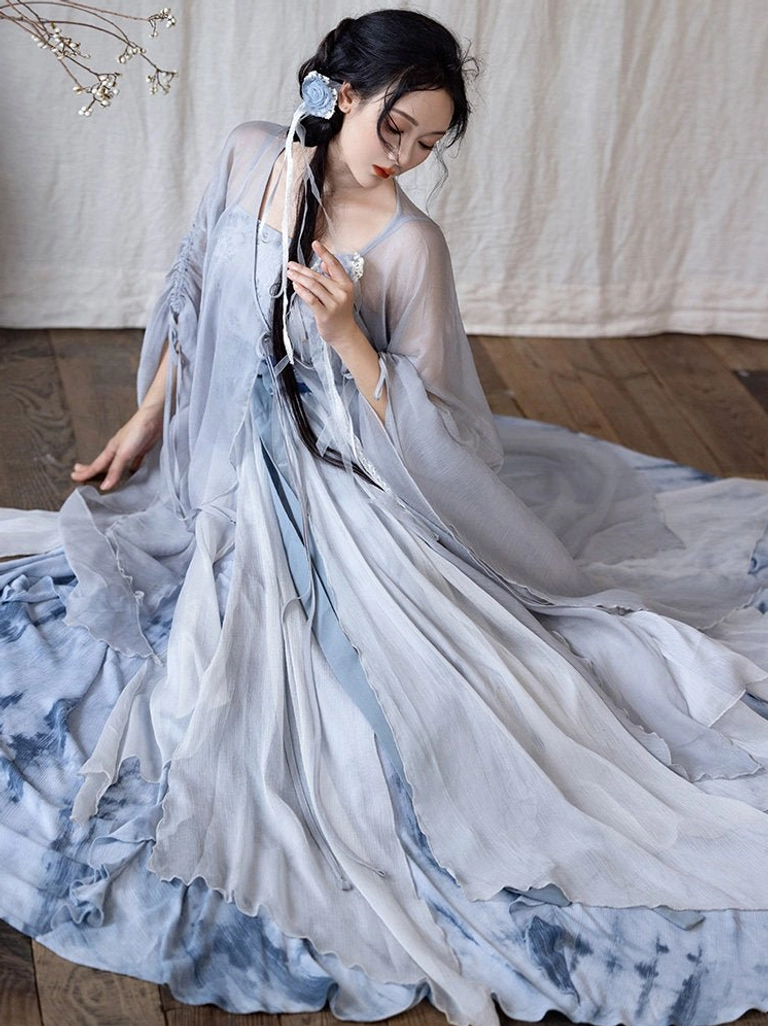 Fallen Whale Song Dynasty Hanfu side view displaying the dramatic spread of the blue grey tie-dye ruffled long skirt
