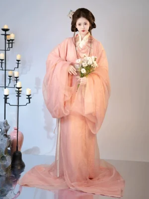 Front view of dusty pink Han Dynasty straight hem hanfu robe set with wide flowing sleeves and long trailing skirt