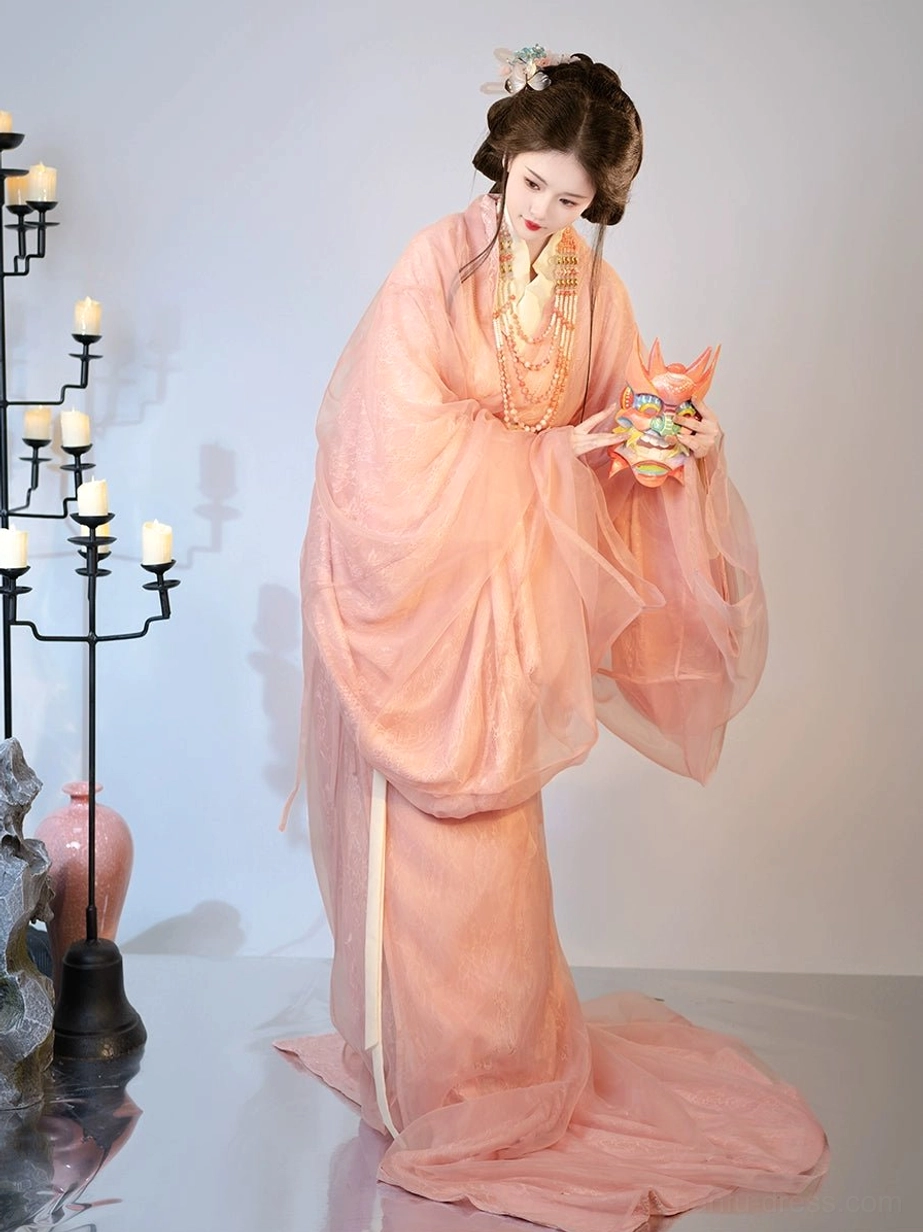 Three-quarter side view of pink Warring States inspired Hanfu robe with sheer outer layer and pearl accessories