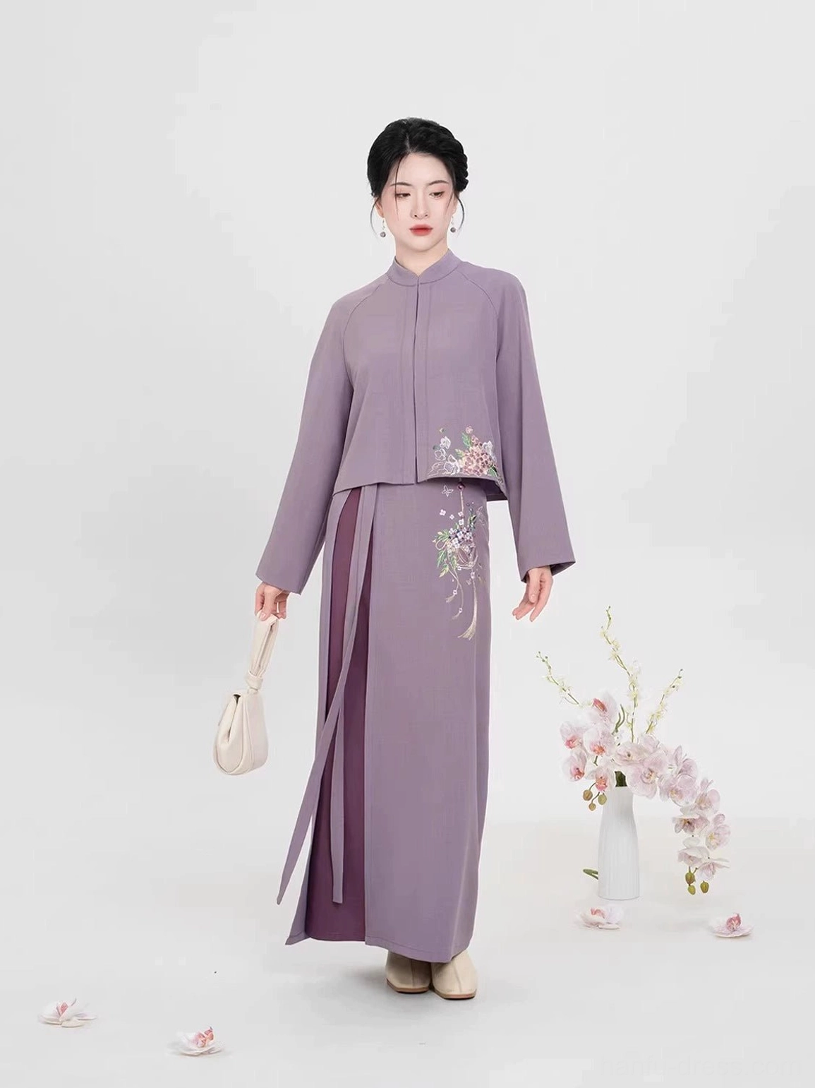 Modern Ming Dynasty Hanfu outfit with purple stand-collar cropped top and floor-length wisteria embroidered wrap skirt