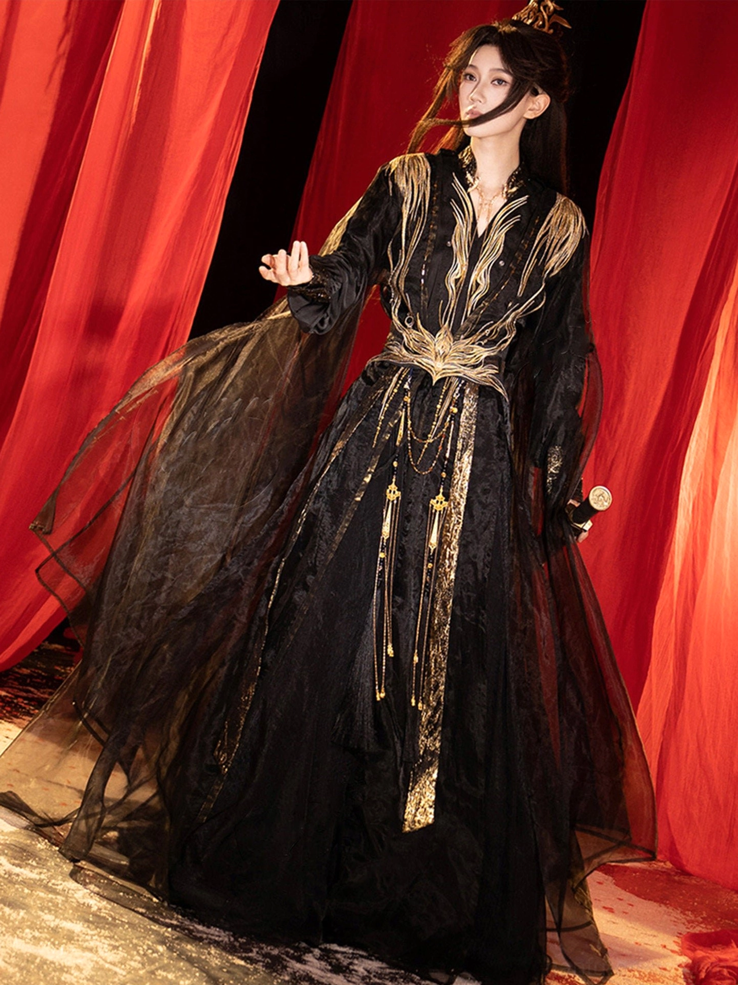 Three-quarter view of a fantasy Wei Jin Dynasty Qiyao Ruqun Hanfu with wide sheer sleeves, hanging gold tassel ornaments and floor-length train
