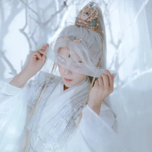 Model wearing a complete Feather Fairy Hanfu hair accessories set with blue and white crown, forehead chain, tassel pendant, and elegant white Chinese fairy costume