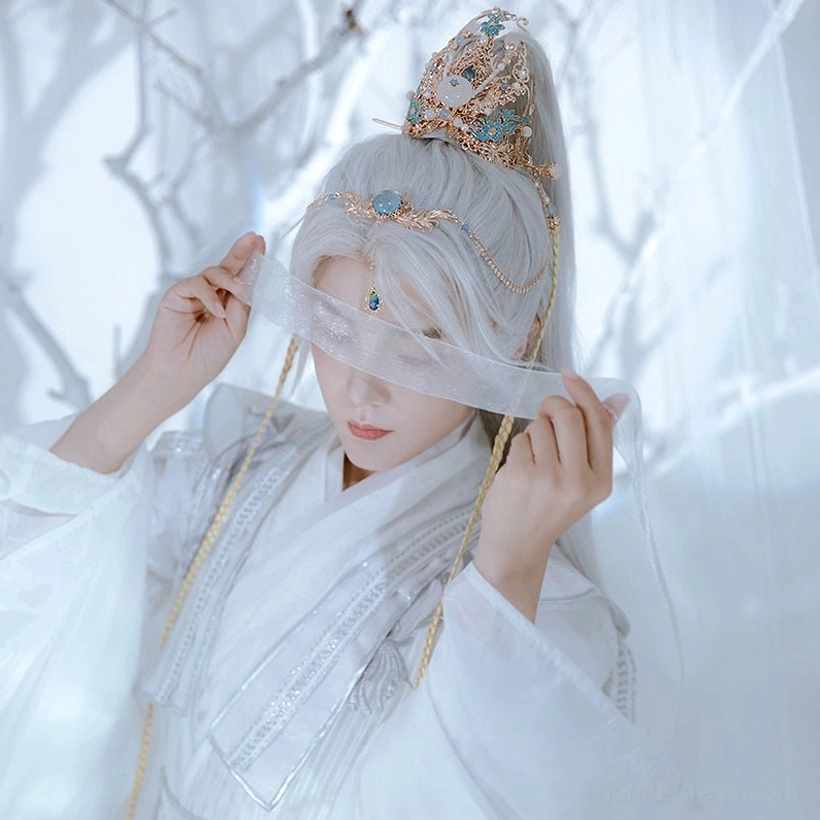 Model wearing a complete Feather Fairy Hanfu hair accessories set with blue and white crown, forehead chain, tassel pendant, and elegant white Chinese fairy costume