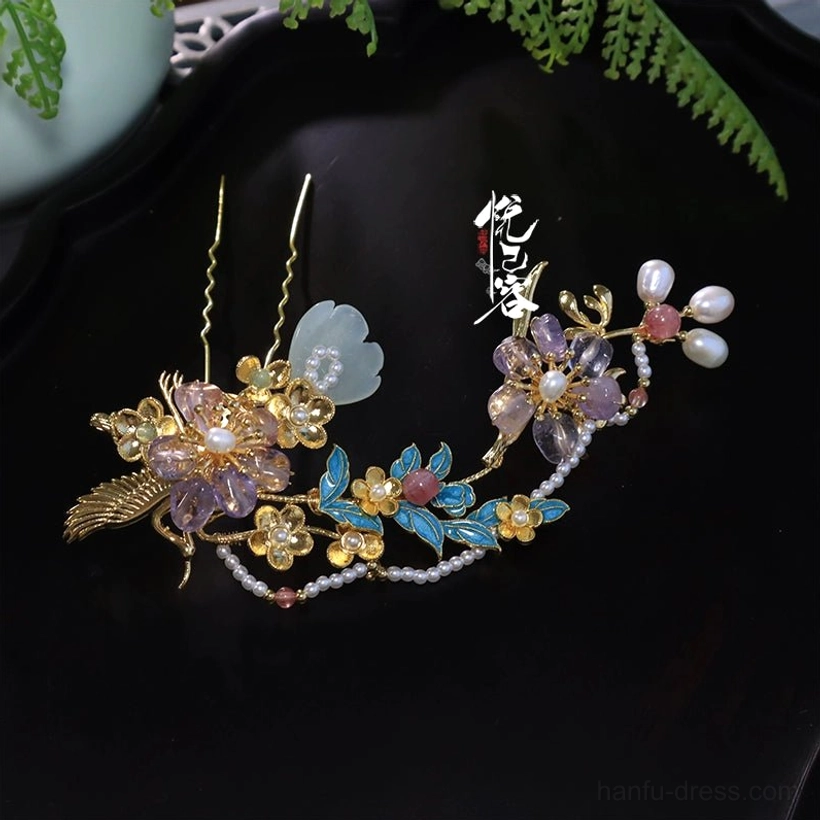 Close up of Fei Xian Ling blue floral hanfu hairpin with gold tone metal jade look petals purple beads and pearl accents