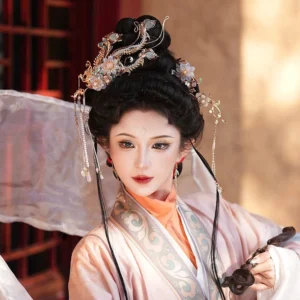 Model wearing a complete Fengshuang Yin Hanfu hair accessories set with phoenix pin, gilded metal filigree, colorful flower ornaments, and long tassels