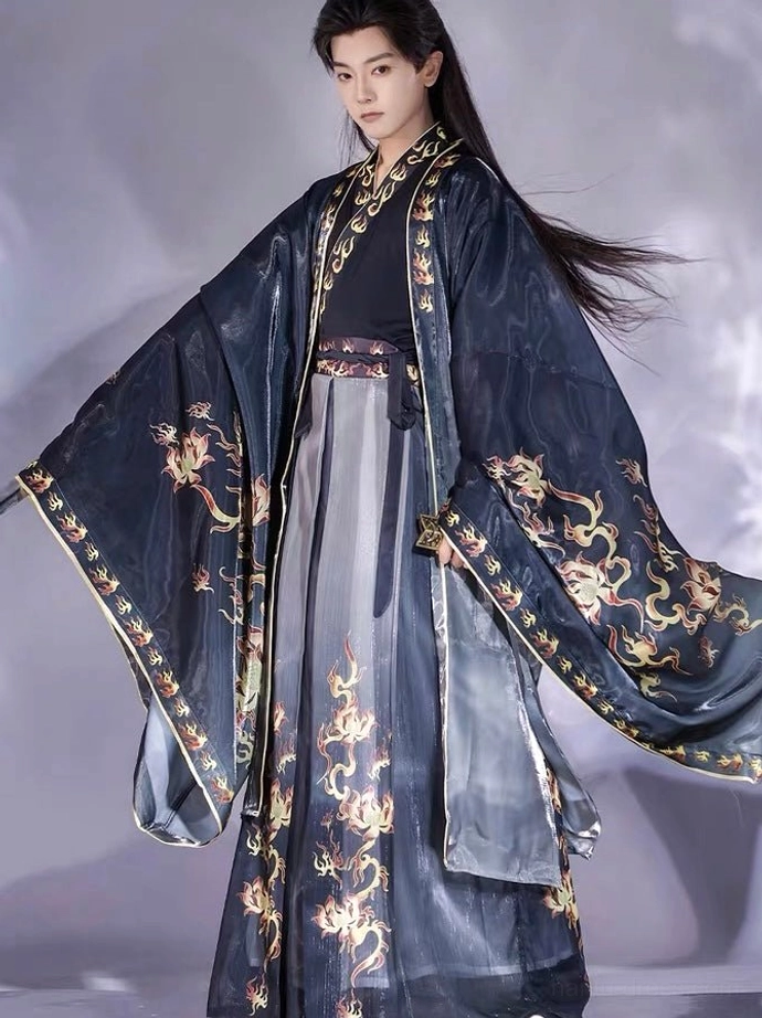 Fire Decree dragon hanfu for men three-quarter side view showing flowing black outer robe gold trim and grey wrap skirt