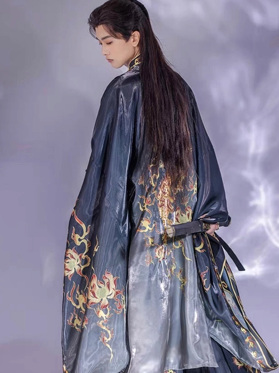 Fire Decree Wei Jin style hanfu for men full back view showing wide black sleeves large flame artwork and waist sword