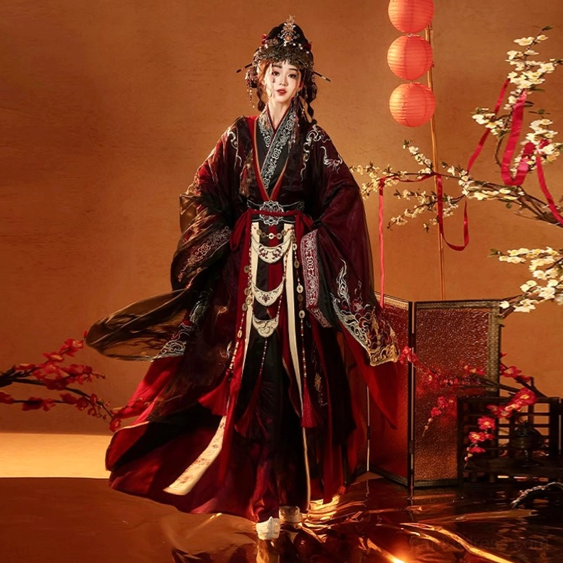 Low-angle front view of Fire Lotus Warring States Han Dynasty wedding hanfu complete set with layered red black robes embroidered trim and waist belt