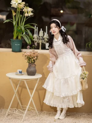 Ming-inspired pink hanfu top and ivory horse face skirt styled with a flower basket in a vintage cafe setting