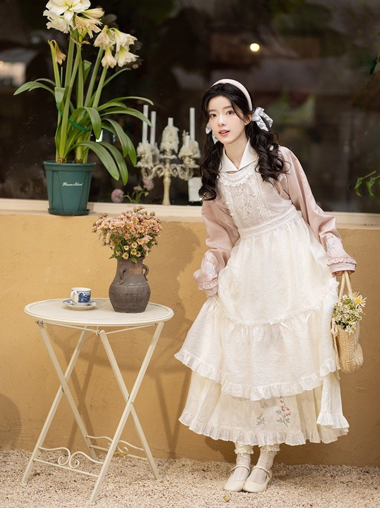 Ming-inspired pink hanfu top and ivory horse face skirt styled with a flower basket in a vintage cafe setting