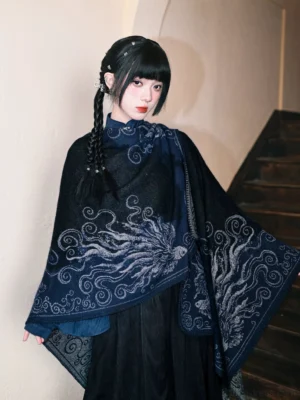 Modern Hanfu oversized wrap shawl in black and dark navy with woven mythical fish fin and cloud motifs side view