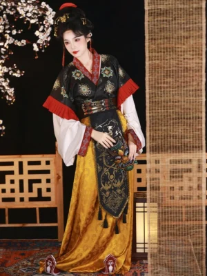 Floating Lights Wei Jin Dynasty Qiyao Ruqun Hanfu in a vintage Chinese studio, showing a black embroidered cross-collar top with red trim, white layered sleeves, and a golden-yellow dragon patterned skirt