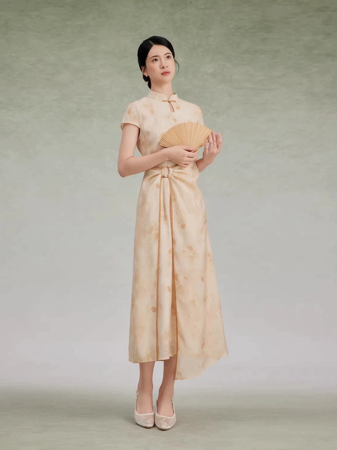 Full front view of floral asymmetrical cheongsam dress with Mandarin collar, frog button and twisted waist detail