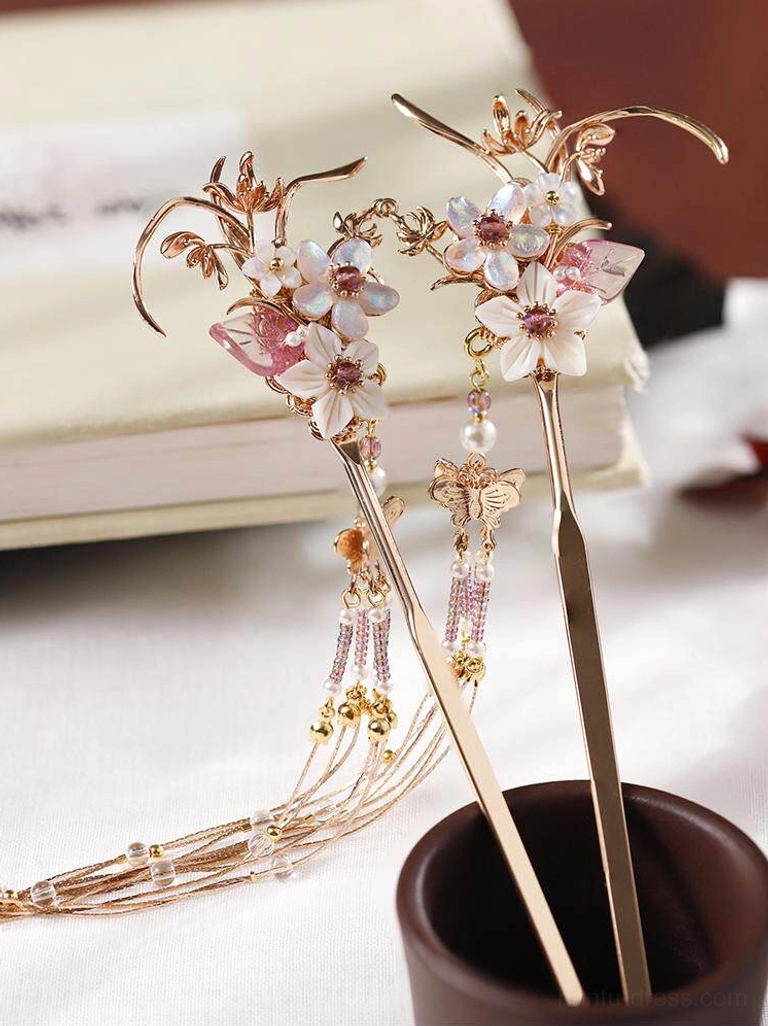 Pair of floral Chinese hair sticks with pink flowers, pearl beads, gold-toned metal details, butterfly charm, and long tassels for Hanfu hairstyles