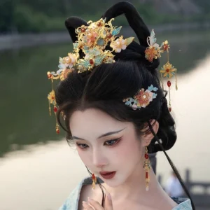 Side view of floral Hanfu hair crown, matching hair ornaments and tassel earrings styled with a traditional Chinese outfit