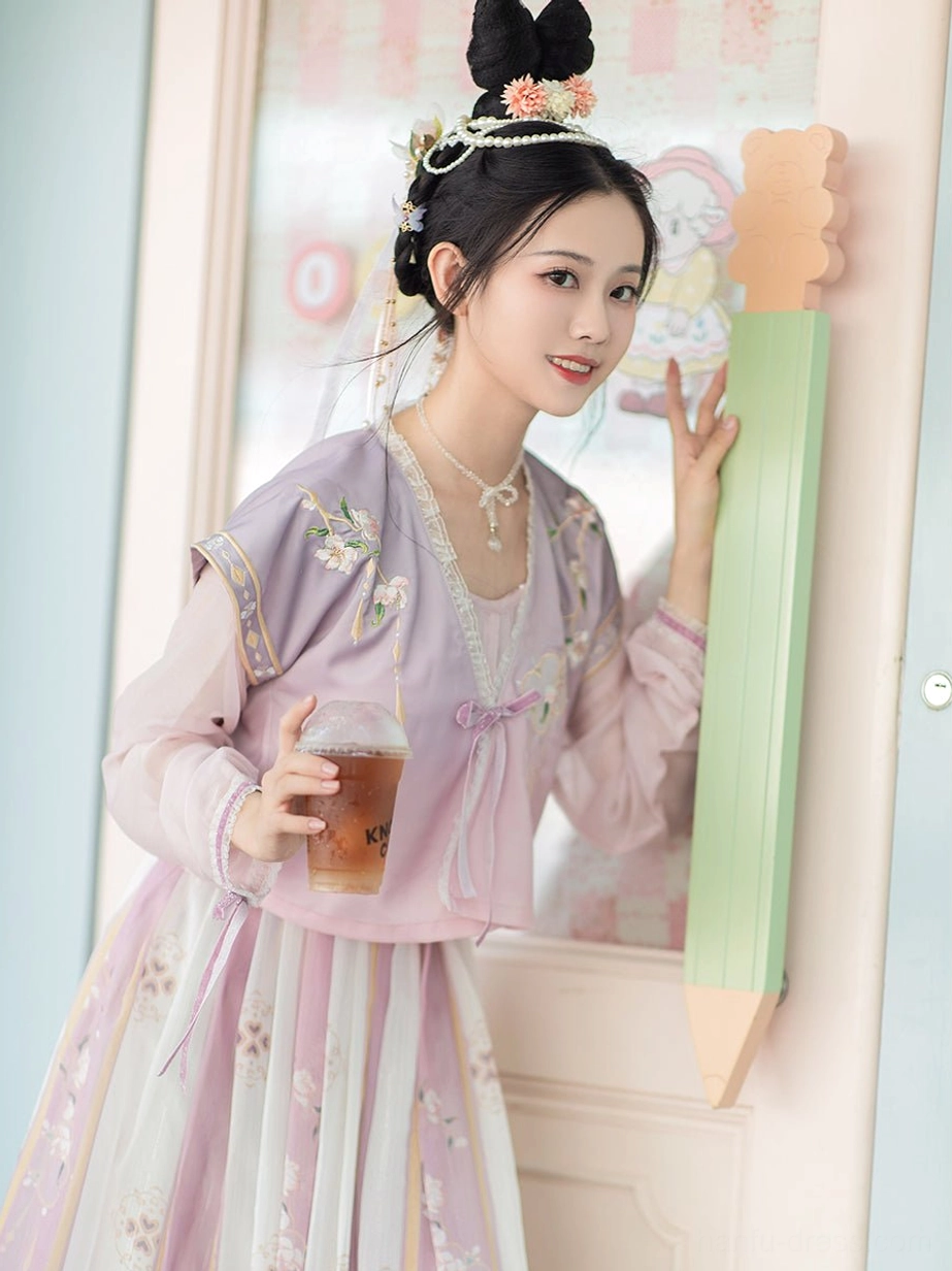 Three quarter view of Flower Collector Tang Dynasty Hanfu set showing sheer long sleeves, tie-front blouse and lavender beizi