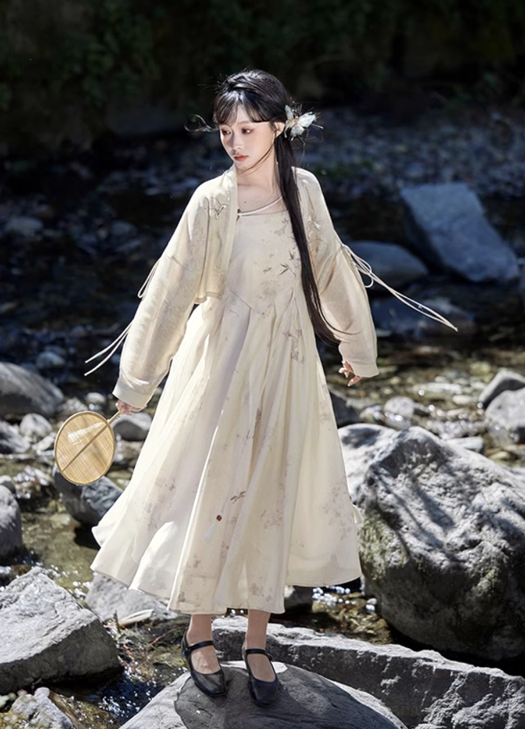 Side view of Flower Paper modern Tang Dynasty Hanfu dress set with matching printed cardigan and round silk fan