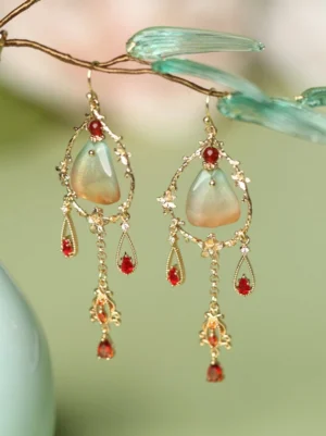 Flying Dunhuang gradient jade-tone tassel Chinese earrings displayed on bamboo branches with gold-tone filigree frame and red crystal-style drops