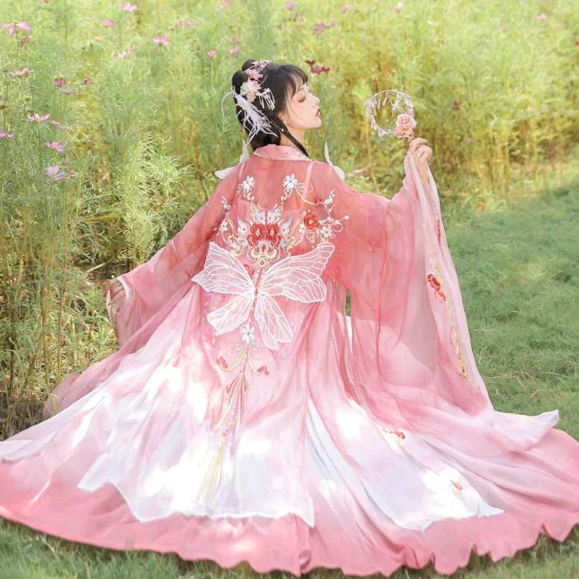 Back view of Flying Flower Tang Dynasty Hanfu Heziqun outfit with large butterfly embroidery, floral upper garment, and flowing sleeves