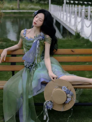 Forest fairy modern Hanfu bustier and asymmetric layered green skirt worn in a lakeside park portrait