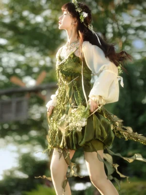 Side view of forest green Chinese style fairy dress and cardigan set with draped leaf frills flowing ribbons and woodland-inspired tassel hem