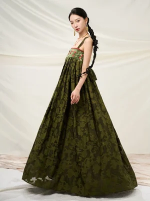 Forest green embroidered modern Hanfu sundress shown in a three-quarter front full-body view with floral bodice and flowing pleated skirt