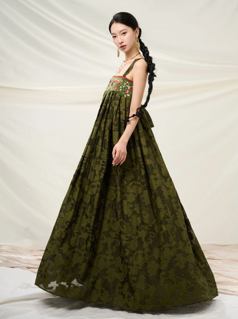 Forest green embroidered modern Hanfu sundress shown in a three-quarter front full-body view with floral bodice and flowing pleated skirt
