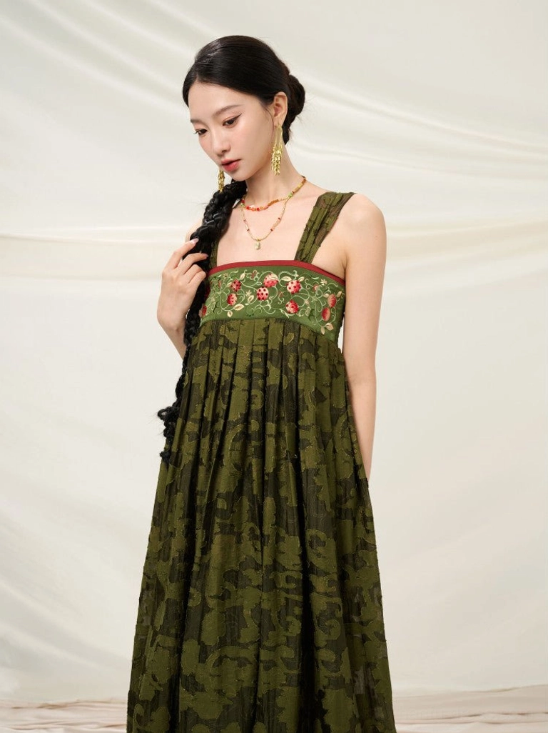 Close-up of red floral embroidery on the forest green square-neck bodice of a Modern Hanfu summer sundress