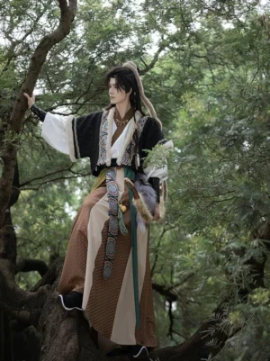 Men’s Hanfu layered forest outfit showing black embroidered faux-fur vest over off-white cross-collar top