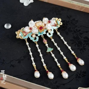 Fourth Hour blue enamel pearl tassel Hanfu back hair pin with red decorative stones and butterfly detail on dark floral fabric