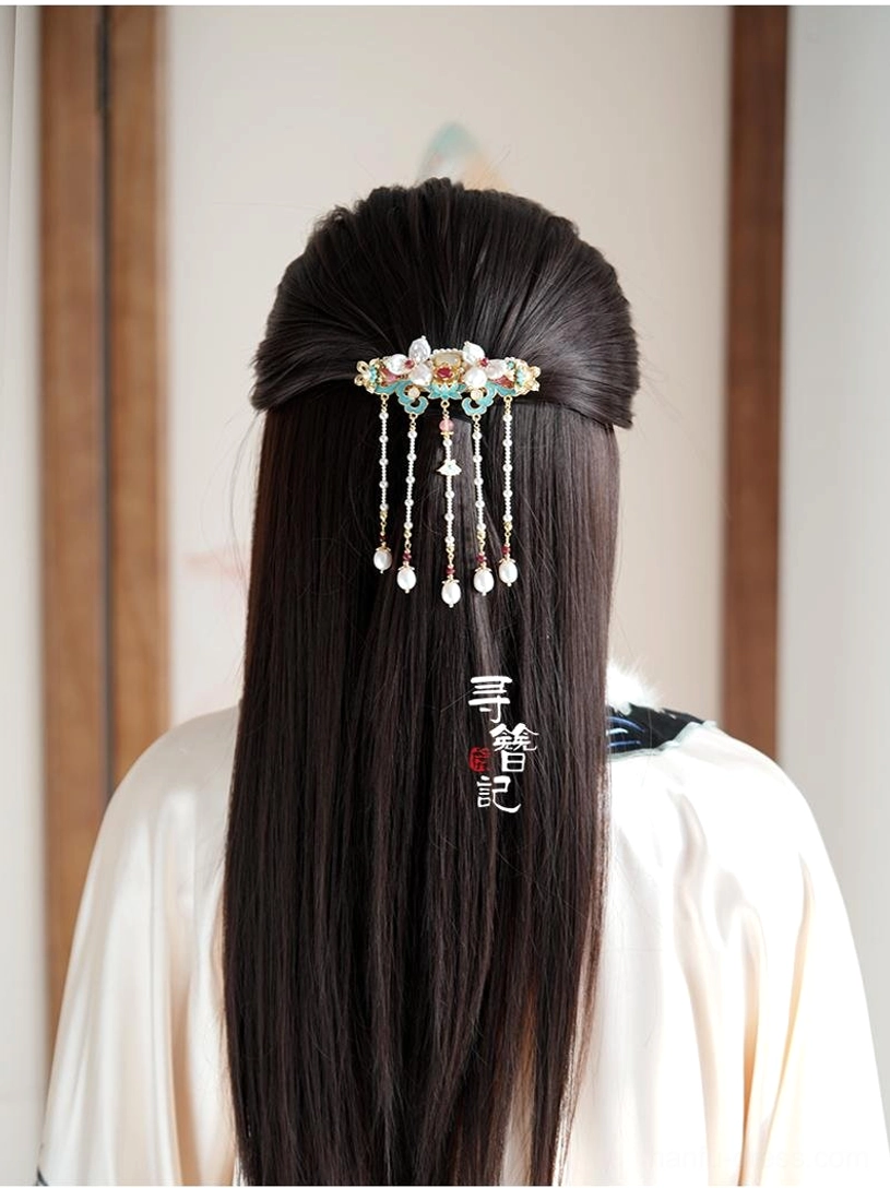 Woman wearing Fourth Hour Chinese Hanfu back hair ornament in a half-up hairstyle with long pearl tassels cascading over black hair